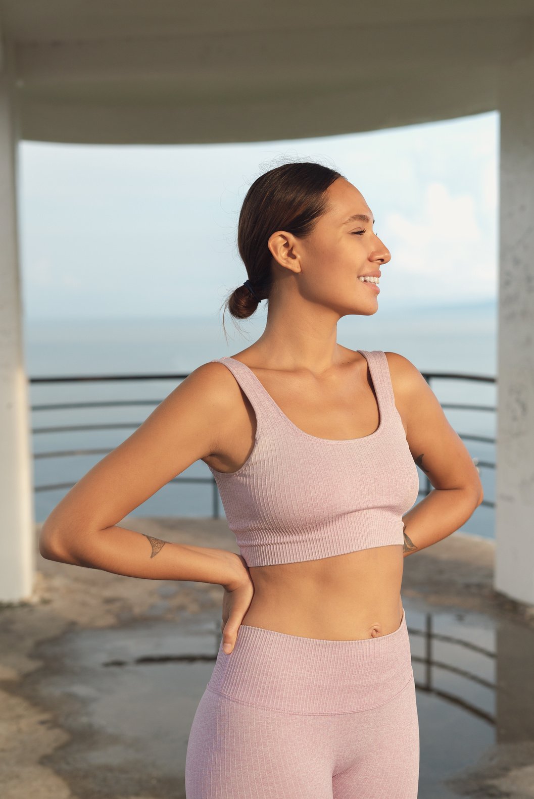 Fit Woman Standing With Hands on Hip